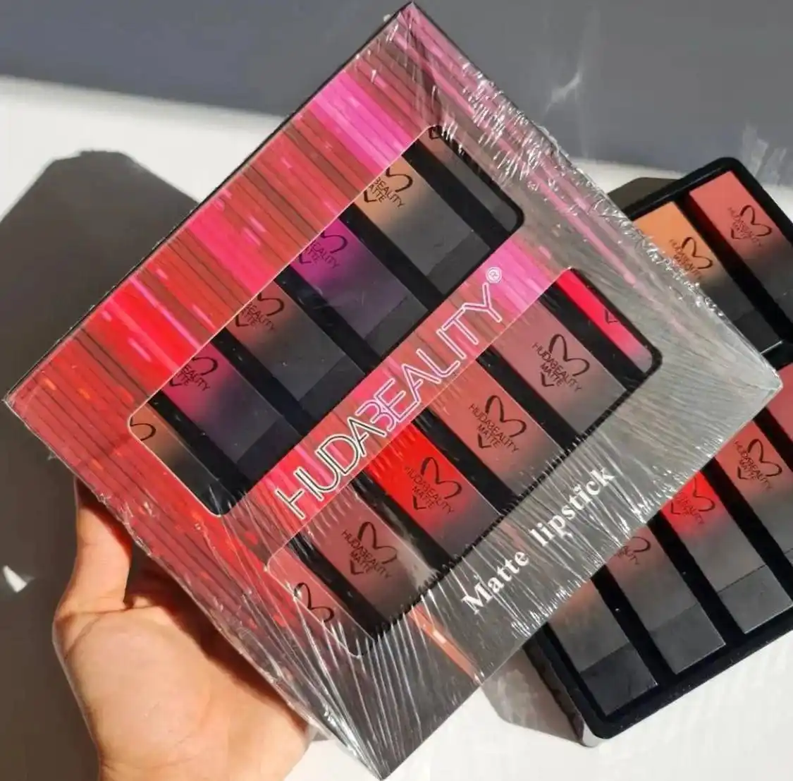 Image from كوزمتك ياسمين كالشي وكال شي 🛍️💄🥰: HUDA BEALITY🫶🏻 سيت حمر من هدى بيوتي ستك 💄 12 لون الحلو بهاي الحم...