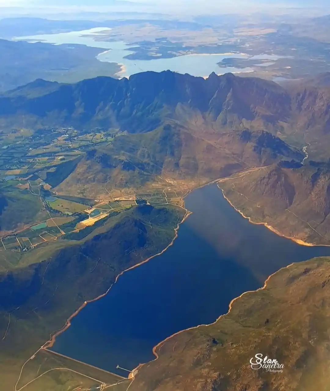 Image from Stellenbosch Municipality: What a view! 💙 The Bergriver Dam with the stunning Franschhoek Wine V...