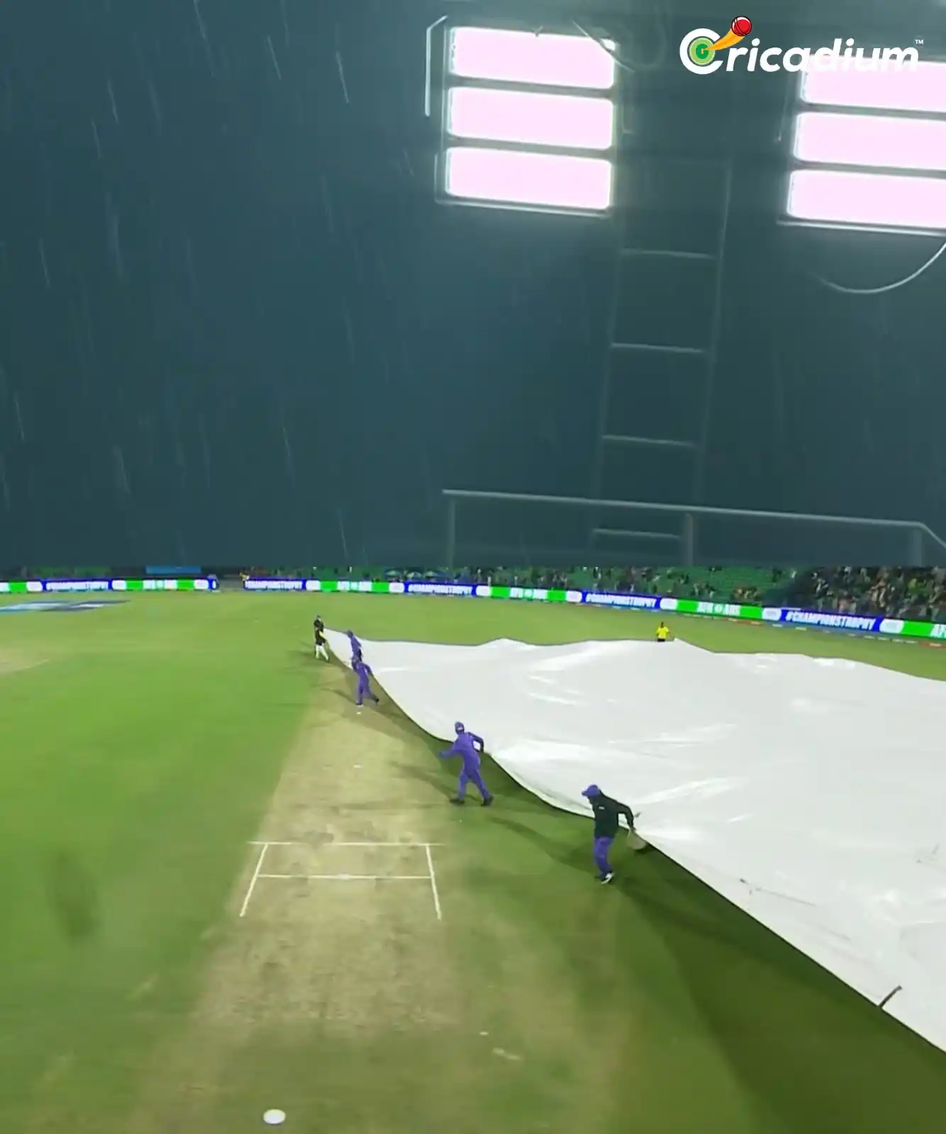 Image from Cricadium🏏: Heavy rain in Lahore, and the players are off the field now! 🌧️⏸️ 📸...