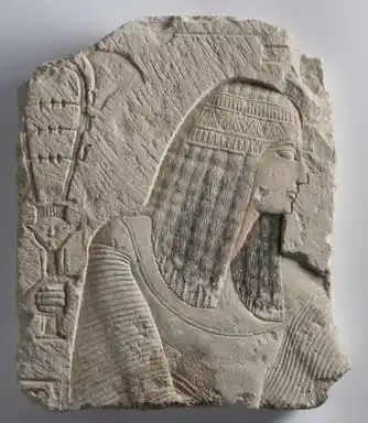 Image from Ancient Egyptian Civilization (AEC): A Painted Limestone Relief of a Noble man wearing a wig and a Collar. ...